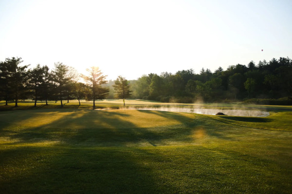 Golfer at the end of his swing, at the Georgia golf tournament to benefit veterans